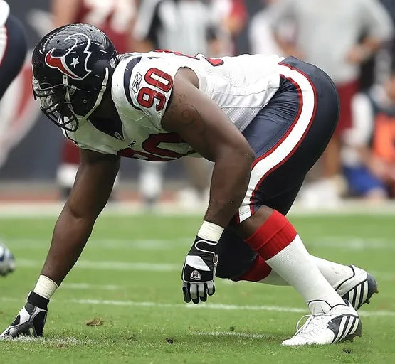 Football player in Houston Texans uniform on the field